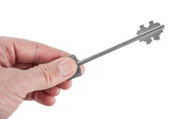 Isolated shot of holding house keys on a white background