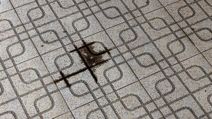 engine oil leakage on concrete floor. Black engine oil on concrete floor. Engine oil leak from the...
