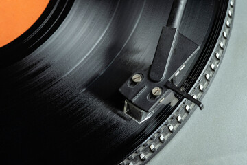 Turntable vinyl record player. Vintage vinyl record player. The needle on a vinyl record. Selective...