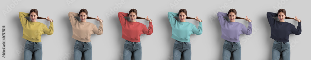 Wall mural A template of a bright crop sweatshirt on a girl, straightens her hair, isolated on a background in the studio, front view. - Wall murals
