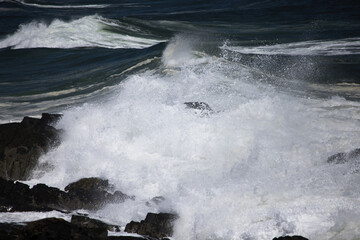 Ocean waves splashing on a rocky shore