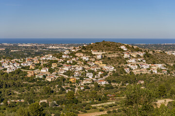 Beautiful panorama overlooking a distant town with the sea and forest in the background