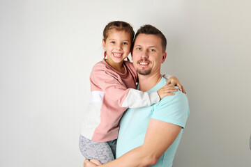 Happy young father dancing with his daughter