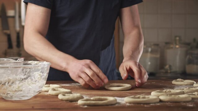 Home baking - making fresh Greek bagels or koulouri of Thessaloniki.