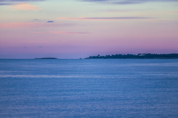 Sunrise over bay of Cannes with Cap d'Antibes and Iles de Lerins, France