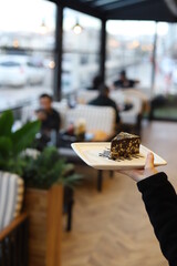 holding plate with cake