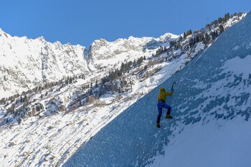 Naklejka na ściany i meble Skiing in the mountains
