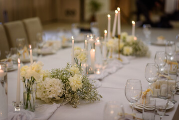 Table setting, serving closeup. Wedding setup detail. Banquet decoration in hall restaurant. Luxury...