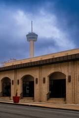 Dramatic blue winter storm clouds over the Alamo Street with partial skyline view of the Tower of...