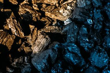 Black coal stones close-up. Solid advertising background..