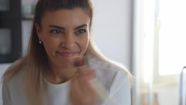 Brazilian Smiling Woman Apply Makeup. Put On Color Correction Cream With Cosmetic Brush Female Morning Routine In Bathroom. Soft Focus