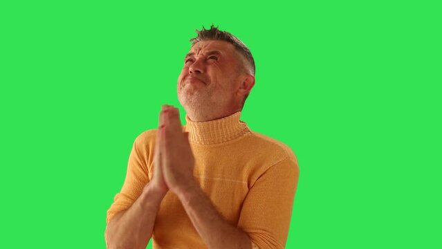 Men praying and asks for favor. On green screen.	