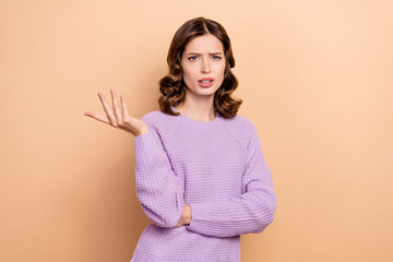 Photo of unsatisfied lady wear violet stylish clothes complaining bad service isolated on beige...