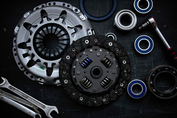new clutch kit in a car service with a flywheel bearing before being installed on the car. - obrazy, fototapety, plakaty