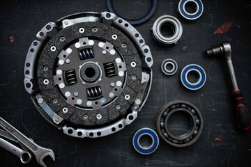 new clutch kit in a car service with a flywheel bearing before being installed on the car.