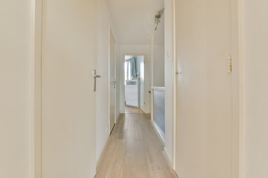 White corridor with doors in apartment