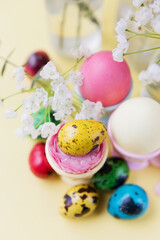 Easter eggs, flowers on yellow background