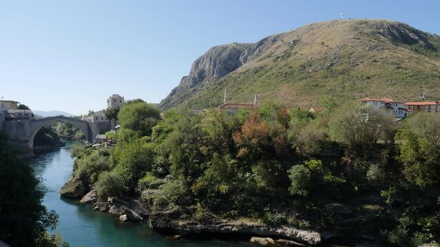 the "old Bridge", "Stari Most" and the river Neretva, one part the city and one uniting it back together
