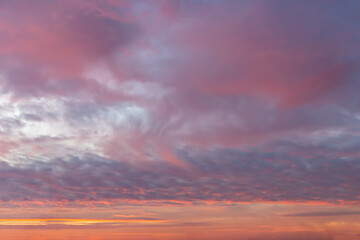 Naklejka na ściany i meble Beautiful evening sunset sky with pink clouds