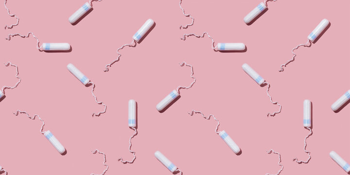 Women's tampons on a pink background pattern. Hygiene products for menstruation.