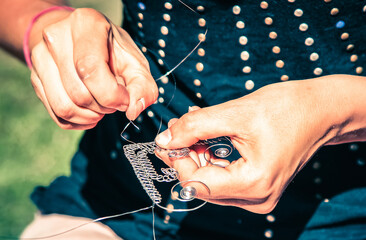 Traditional tinker (Drotar) making a product from wire - Folk art