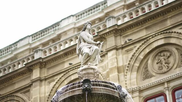 fountain outside Wiener Staatsoper, Vienna State Opera in Vienna, Austria. Historic venue for classical opera, ballets, music theater and concerts.