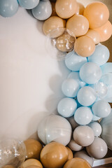 Details. Arch decorated with blue, brown, grey balloons. Photo-wall decoration space, place for...