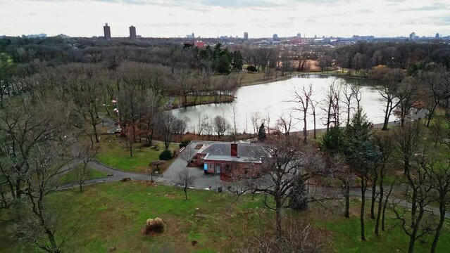 Aerial flyover park with Kissena Lake in Queens District of New York during sunny day
