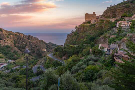 View of Chiesa di San Nicolo Church overlooking town of Savoca at sunset, Savoca, Messina, Sicily, Italy, Mediterranean, Europe
