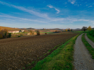 Fototapeta na wymiar Plowed fields in late autumn. Piedmont region, Italy.