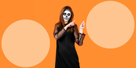 Portrait of a handsome boy with sugar skull makeup over bright yellow background. Halloween. Dia de...