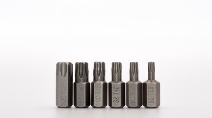 torx bits set and hex shank isolated on white background. Closeup of steel star screwdrivers kit