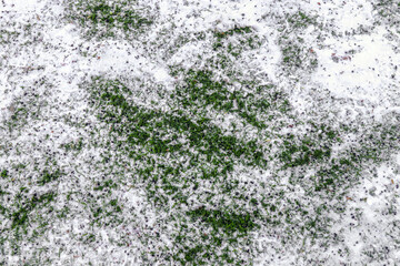 artificial grass turf under snow in winter
