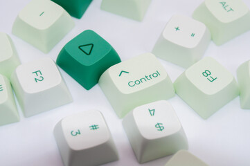scattered keyboard keys on white background, control key