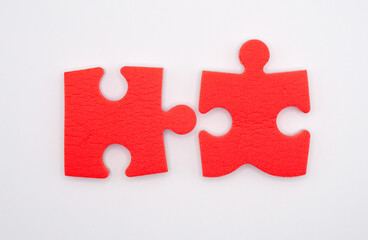 puzzles of red color on a white background