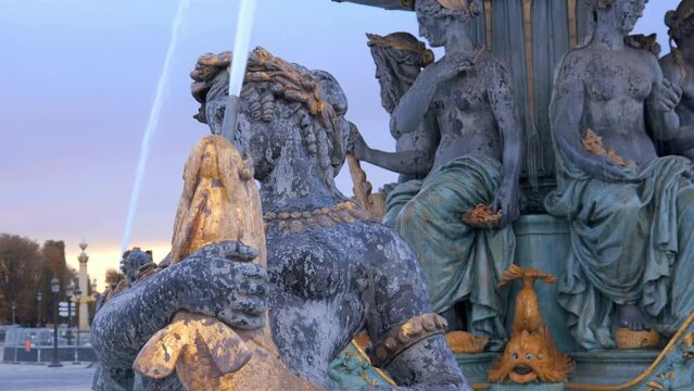 Close up on a naiad of a water fountain on the Place de la Concorde square in Paris, France
