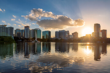 Orlando city at sunset in Lake Eola Park with fountain and cityscape, Florida, USA