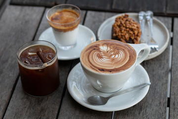 Set of coffee (Latte and Americano) menus serve on wood table.