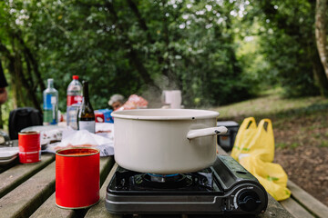 macaroni boiling in the casserole in a gas camping site - obrazy, fototapety, plakaty