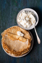 Delicious thin ruddy pancakes with sweet vanilla cottage cheese filling