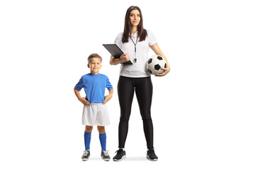 Boy posing next to a female football coach