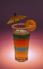 bright rich exotic cocktail in a tall glass with an umbrella and a piece of fruit on a colored background. for signage labels screensavers signage menu banners