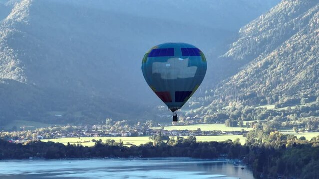 Hot air balloon flying over Annecy Lake in France