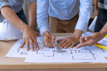 Engineer or architect plan meeting and draw model of office buildings working together and engineering tool to create model and blueprints in the workplace.