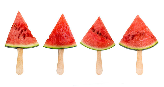 Photo of four watermelon popsicles slices on sticks isolated on white or transparent background. Summer fruit, healthy food concept - Powered by Adobe