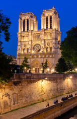 Fototapeta na wymiar Notre-Dame de Paris cathedral and Cite island embankment at night, France