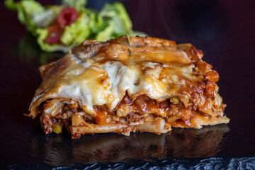 lasagna on black slate