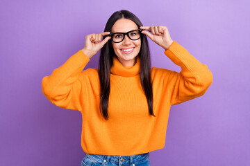 Photo of young cheerful positive lady business company owner try new eyeglasses vision checkup correction isolated on violet color background