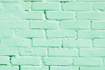 Obraz premium Brick wall with unusual green bricks