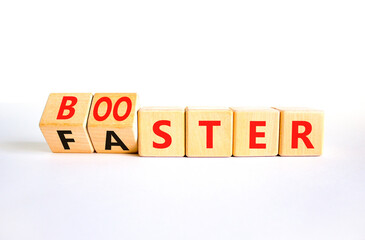 Booster and faster symbol. Concept word Booster Faster on wooden cubes. Beautiful white table white background. Business booster and faster concept. Copy space.